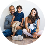 A family gathered on the floor